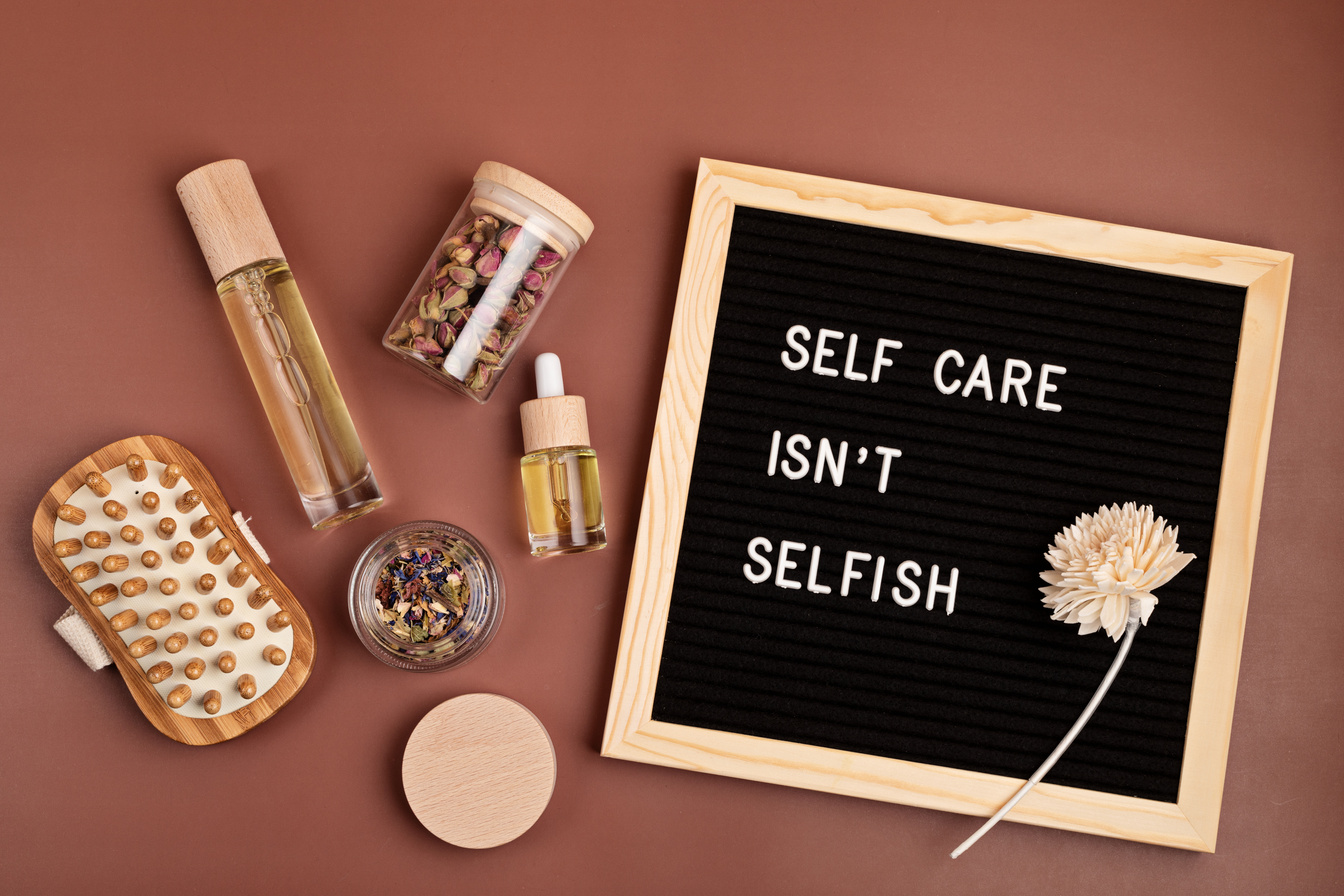 Self care is not selfish. Felt letter board with body and mind care products. Love yourself, physical and mental health idea